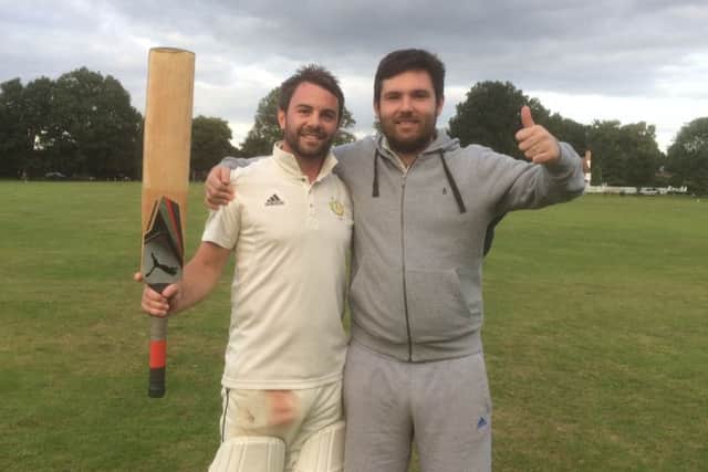 Luke Stickland (left) who hit the winning runs to secure the league title, with Michael Buttlema