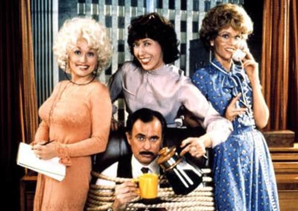 A scene from the movie version of 9 to 5 with 

Dolly Parton, Lily Tomlin, Jane Fonda and Dabney Coleman