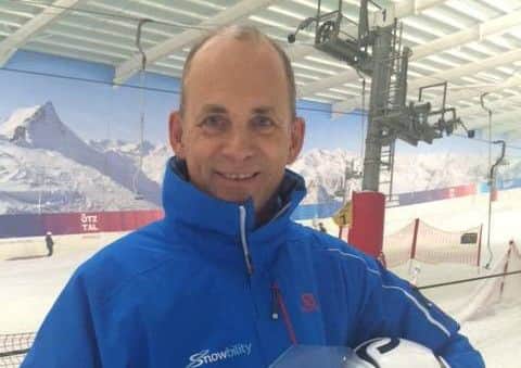 Snowbility instructor Richard Fetherston with his Disability Snow Sports Coach of the Year award