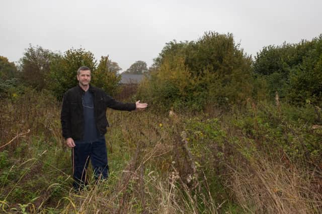 George Lima in the field at the back of The Cow Roast Inn where he hopes to set up a camping site