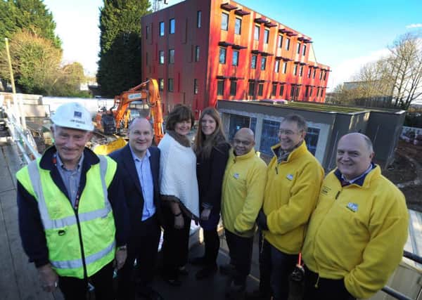 From left, Jim Barker clerk of works DBC, David Barratt DBC,Councillor Margaret Griffiths, Sarah Pickering housing developmnet association,
Paul Latimer,Anthony Culley and Andrew Liversidge, all of DENS, during the build of new hostel The Elms in Redbourn Road, Hemel Hempstead, last year