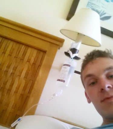 Marc with his cannula, which was hooked up to a lampshade in the couple's hotel room.