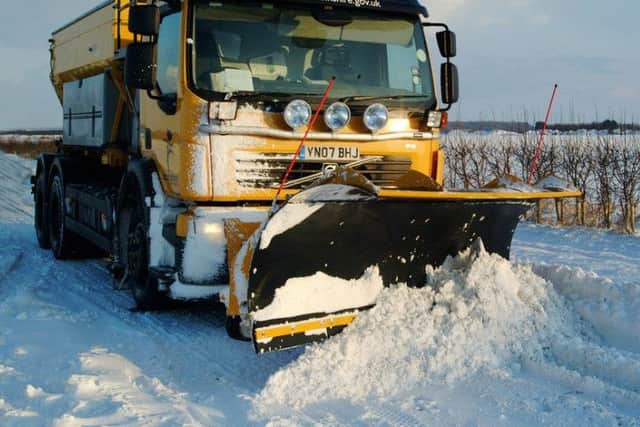 Gritters working in heavy snow.