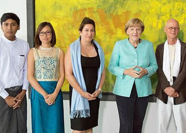 From left: Yangon Film School students Soe Arkar Htun and Lay Thida, Lindsey Merrison, German Chancellor Angela Merkel, German Praemium Imperiale Laureate Wolfgang Laib and Monika Gruetters, Germany's Federal Government Commissioner for Culture and the Media