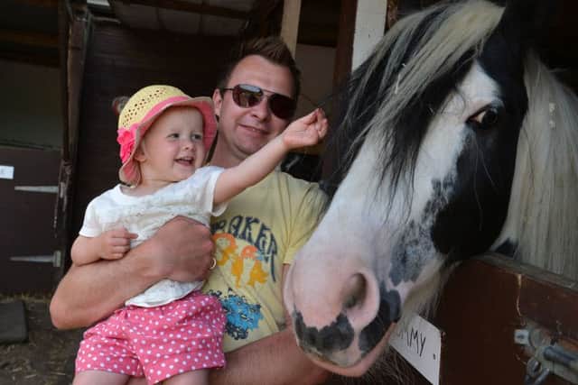 Two Oaks Pony Santuary fun day, Northchurch. Mark and Lila Norcott from Hemel Hempstead with Tommy. PNL-140806-223315009