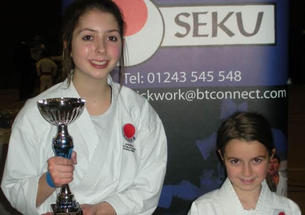 SSKI's Cristy Nash, left, and Crystal Close showed their fighting spirit at the Portsmouth Open Karate Championships