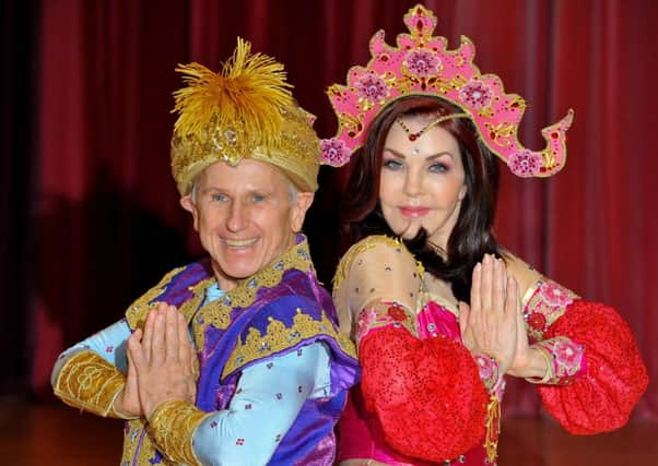 Wayne Sleep as Genie of the Ring with Priscilla Presley as Genie of the Lamp in Aladdin, which opens soon at Milton Keynes Theatre