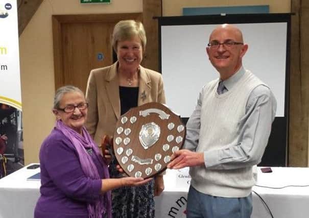Betty Harris receiving the June Street Award.