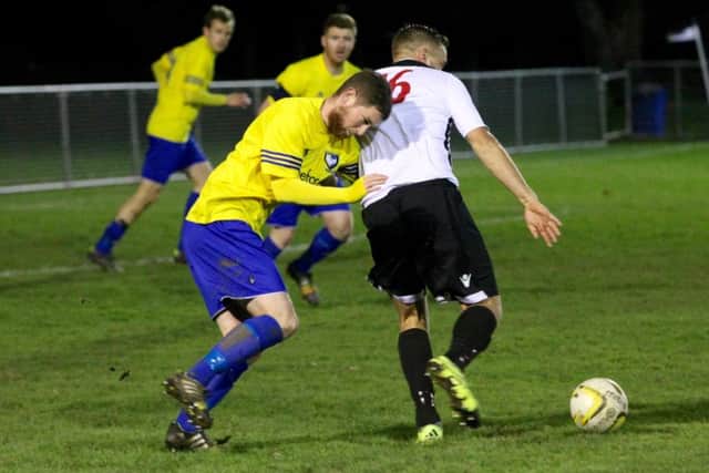 Adam Mead battles for the ball as nine-man Berkhamsted come under increasing pressure. Picture (c) Ray Canham
