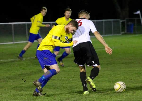 Adam Mead battles for the ball as nine-man Berkhamsted come under increasing pressure. Picture (c) Ray Canham