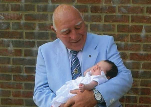Geoff Dell with his youngest granddaughter Emily as a baby