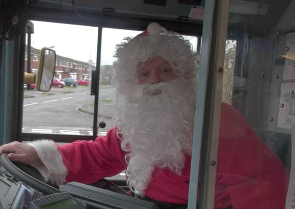 Arriva bus driver Ian Evans, who is dressing up as Father Christmas to raise money for charity