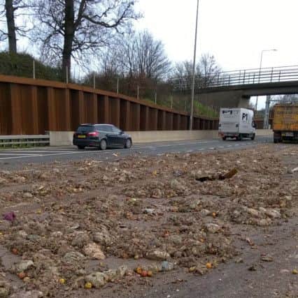 The M25 has been left covered in vegetable waste after a collision involving a lorry and car.