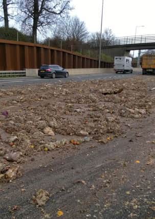 The M25 has been left covered in vegetable waste after a collision involving a lorry and car.