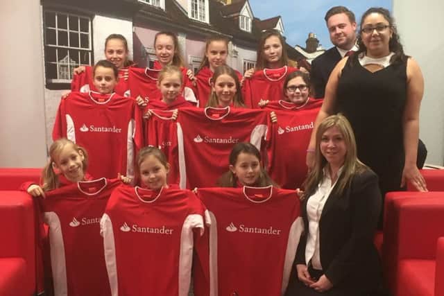 Herts Girls FC have received new kits from Santander