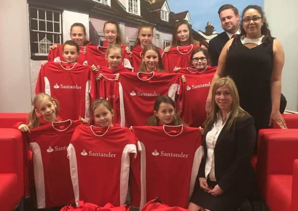 Herts Girls FC have received new kits from Santander