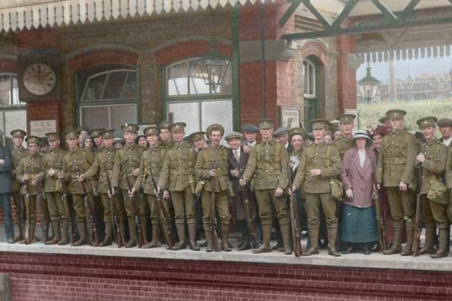 Colourised image of Hertfordshire Regiment men leaving Letchworth station in 1914 PNL-150123-152147001