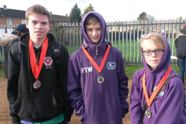 From left, Michael Armstrong, Freddie Truman-Williams and Jamie Bailey won team silver at The Herts County XC Championships