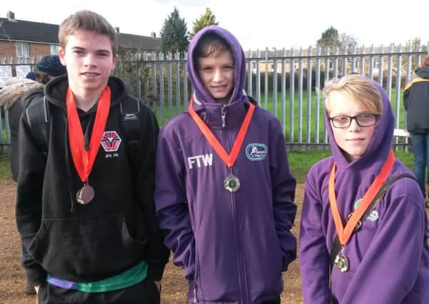 From left, Michael Armstrong, Freddie Truman-Williams and Jamie Bailey won team silver at The Herts County XC Championships