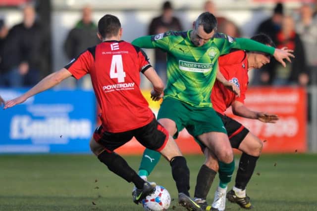 Matt Spring battles for the ball with Hayes skipper Adam Everitt. Picture (c) Terry Rickeard