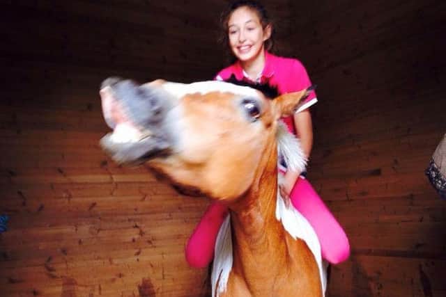Chloe Daniels, 14, on her pony Puzzle