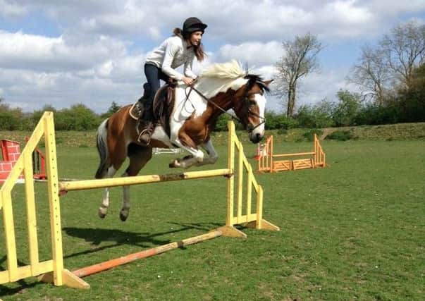Chloe Daniels jumping her 19-year-old pony, Puzzle