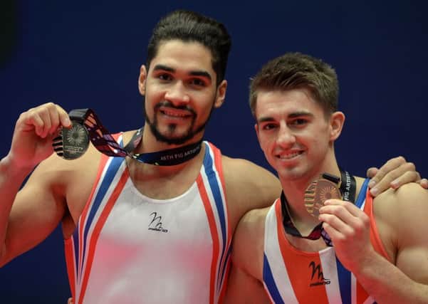 Max Whitlock edged out Team GB team-mate Louis Smith to win World Championship gold on the pommel horse. Photo (c) Owen Humphreys/PA Wire