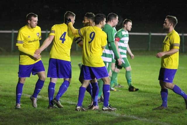 James Baldry gets the congratulations after netting the opener against Holmer Green last night. Picture (c) Ray Canham