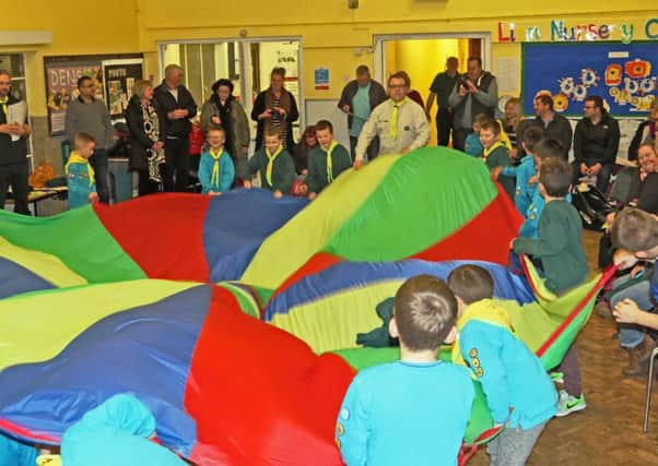 5th Hemel Hempstead (AFC) Beavers emerge from under the parachute to pledge their allegiance to the new 5th Hemel Hempstead Cub pack