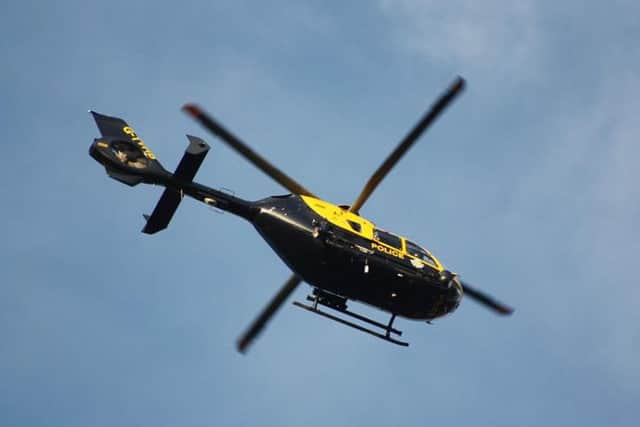 Police helicopter. Photo by Andrew Long