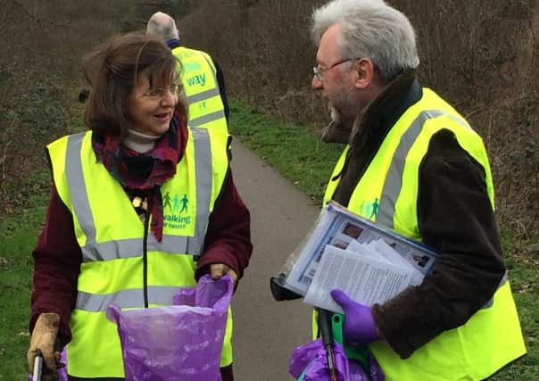 Frances Button, Chairman of Herts County Council, helps out with litter picking on the Alban Way