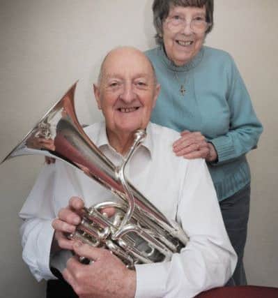 Peter Davis, of Boxmoor, has had 21 leap year birthdays.
Photographed with his wife Eve and his baritone horn.