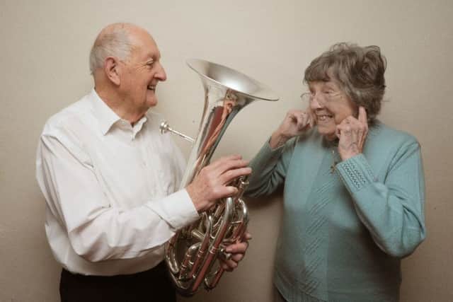 Peter Davis, of Boxmoor, has had 21 leap year birthdays. He is pictured with his wife Eve and his baritone horn.