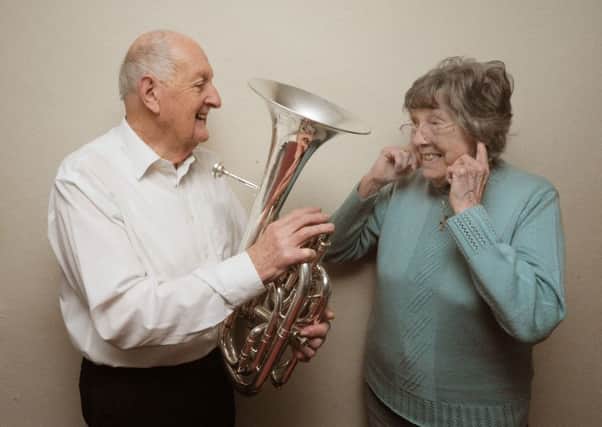 Peter Davis, of Boxmoor, has had 21 leap year birthdays. He is pictured with his wife Eve and his baritone horn.