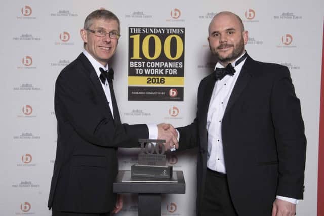 Alex Ford, operations director at Oakman Inns, receiving the Sunday Times Best Companies to Work For 2016 Award from Glenn Dimelow, director of Best Companies, last week.