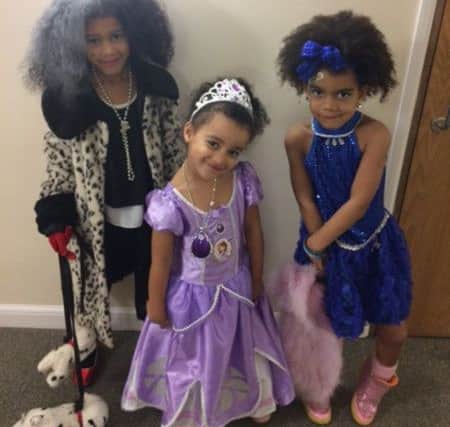 Grace Mboma, eight, as Cruella de Ville; Olivia Mboma, four, as Sofia from Sofia the First and Felicity Mboma, five, as Emily from Emily's Ice Dancing Show PNL-160403-143412001