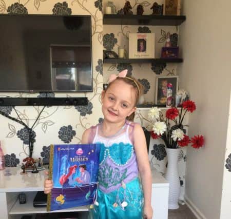 Aaliyah Goodyear, six, as Ariel from The Little Mermaid book PNL-160403-145017001