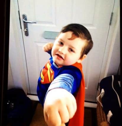 George Collier, six, as Superman PNL-160403-145043001