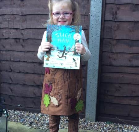 Evie Foster, three, as Stick man, from the book of the same name PNL-160403-151133001