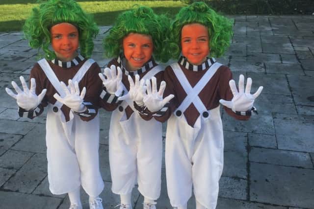 Twins Lilia and Layla Saad, four, and three-year-old sister Ava (centre) as Oompa Loompas from Charlie and the Chocolate Factory