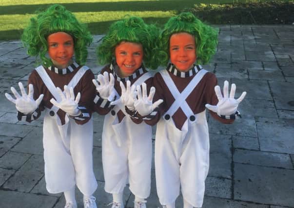 Twins Lilia and Layla Saad, four, and three-year-old sister Ava (centre) as Oompa Loompas from Charlie and the Chocolate Factory