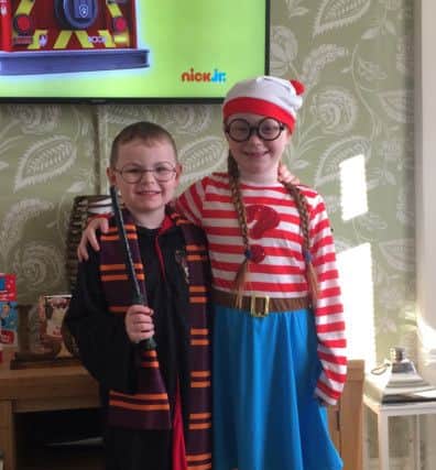 Freddie Groves, five, as Harry Potter and sister Daisy, seven, as Wally from the Where's Wally books PNL-160403-160849001