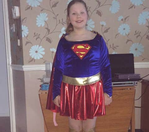 Lauren Scott, 11, as Supergirl PNL-160403-161050001
