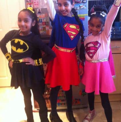 Anisa Saghir, eight, as Batgril; Aisha Saghir, 10, as Supergirl and Sarah eight, Supergirl PNL-160403-173817001