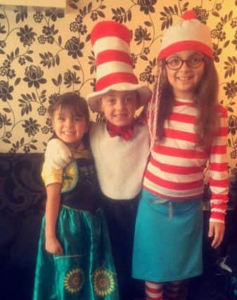 Indie Rogers, four, as Anna from frozen, Jayden Rogers, five, as the Cat in the Hat and China Rae Rogers, eight, as Wanda from the Where's Wally books PNL-160403-173838001