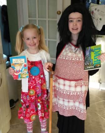 Sadie Beecroft, six, as Enid Blyton's Amelia Jane and sister Holly Beecroft, eight, as Roald Dahl's Mrs Twit. PNL-160403-173859001