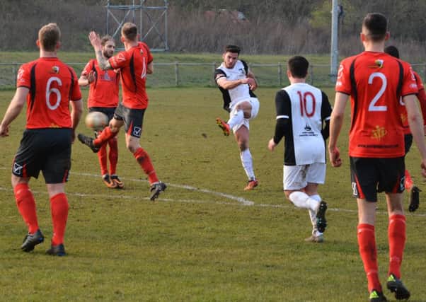 Kings Langley's Gary Connolly volleys the ball home for the first goal. Picture (c) Chris Riddell