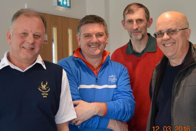 Club captain Chris Miles with the winning team of Karl Burn, Brian Ridgway and Mike Mason