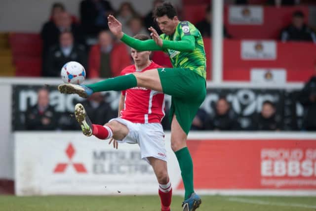 Adam Bailey-Dennis challenges for the ball. Picture (c) Terry Rickeard