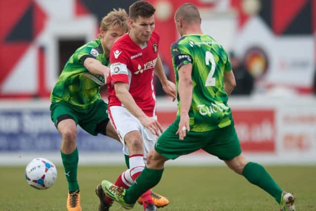 Harry Hickford and Ben Herd challenge for the ball. Picture (c) Terry Rickeard